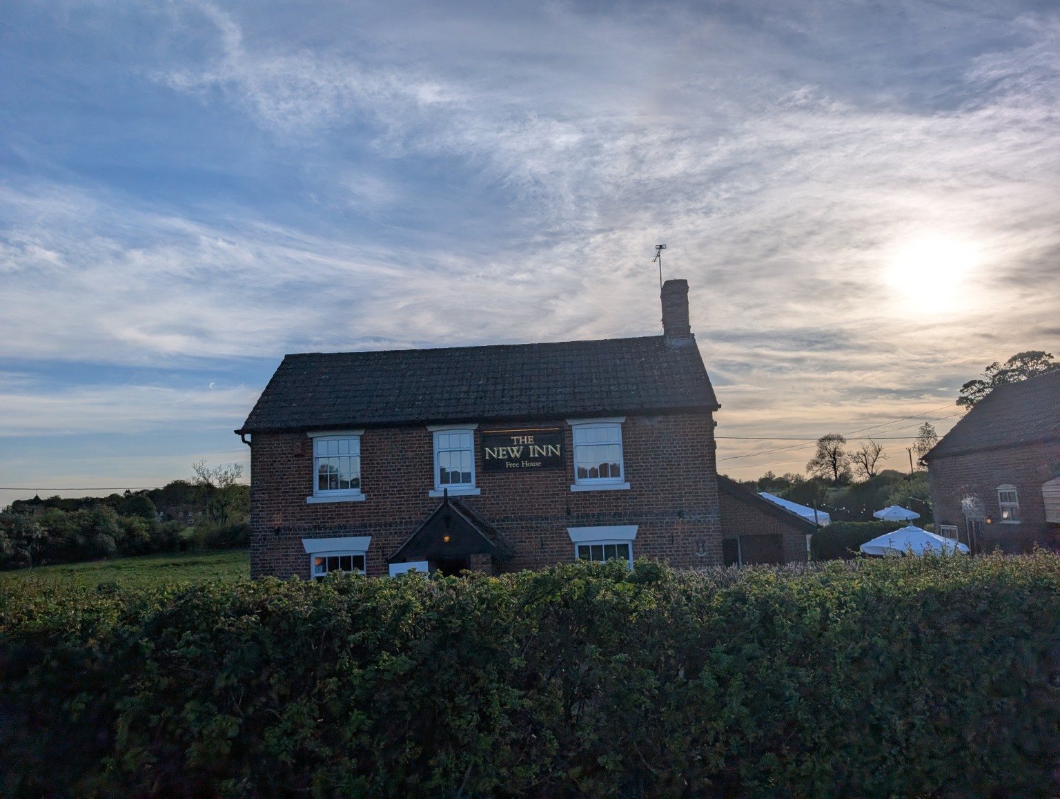 The New Inn at sunset, next door to Elderbrook House.