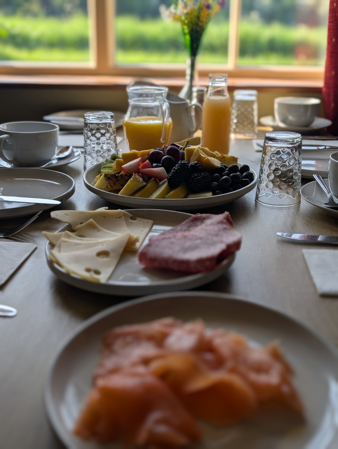 Smoked salmon, fruit, juice and coffee on the Elderbrook breakfast table.